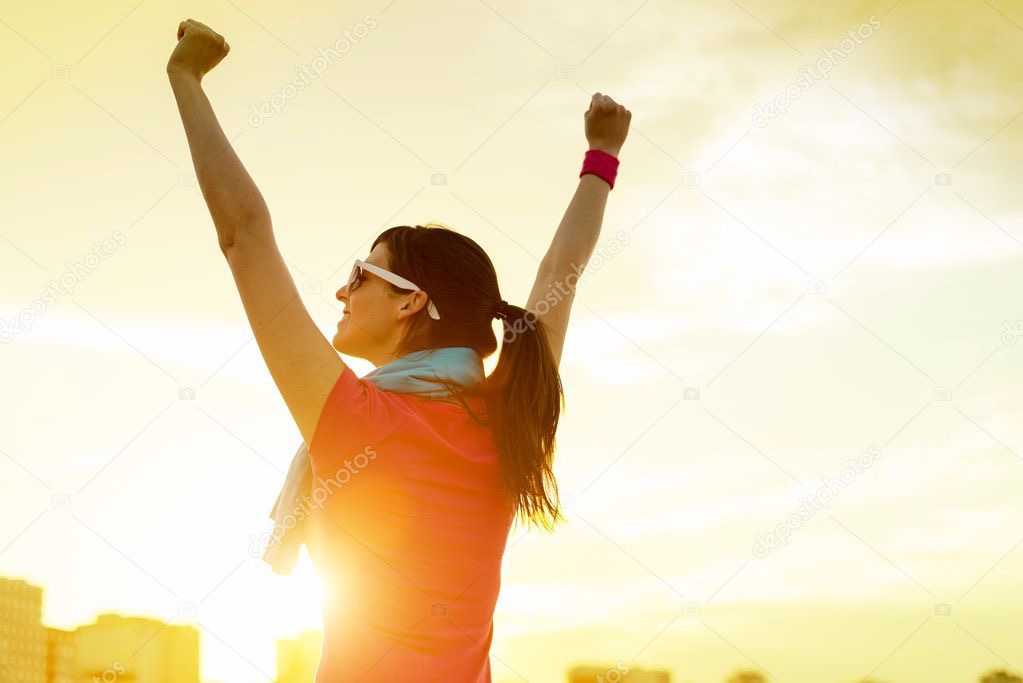 depositphotos_23477727-stock-photo-sportswoman-with-arms-up-celebrating